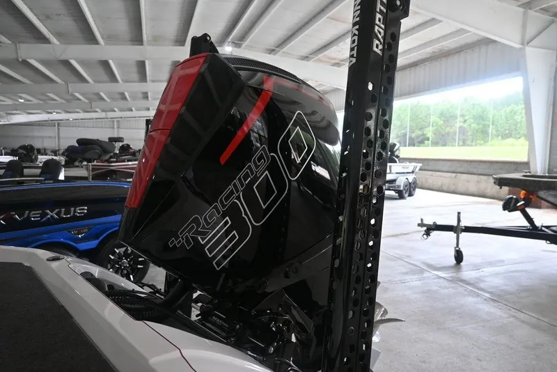 Slide: The Image of 2026 Vexus VX s21 boat with Racing 300 engine in a garage setting. - 4
