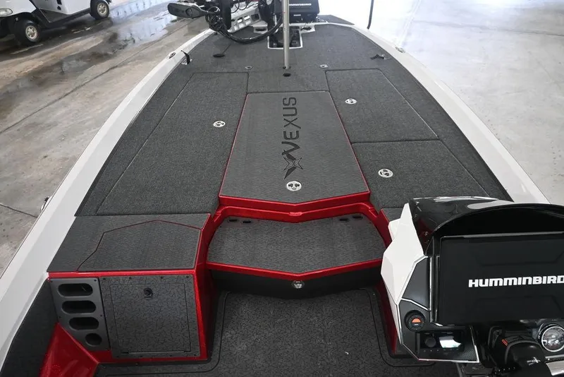 Slide: The Image of 2026 Vexus VX s21 boat interior with Humminbird electronics, featuring sleek design and storage compartments. - 5