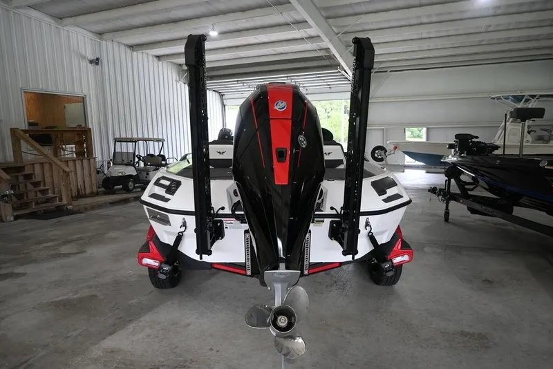 Slide: The Image of 2026 Vexus VX s21 boat in a storage facility, showcasing rear view and motor. - 6