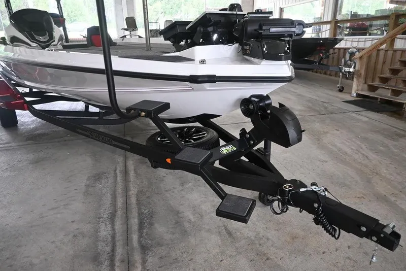 Slide: The Image of 2026 Vexus VX s21 boat on trailer in a garage setting. - 8