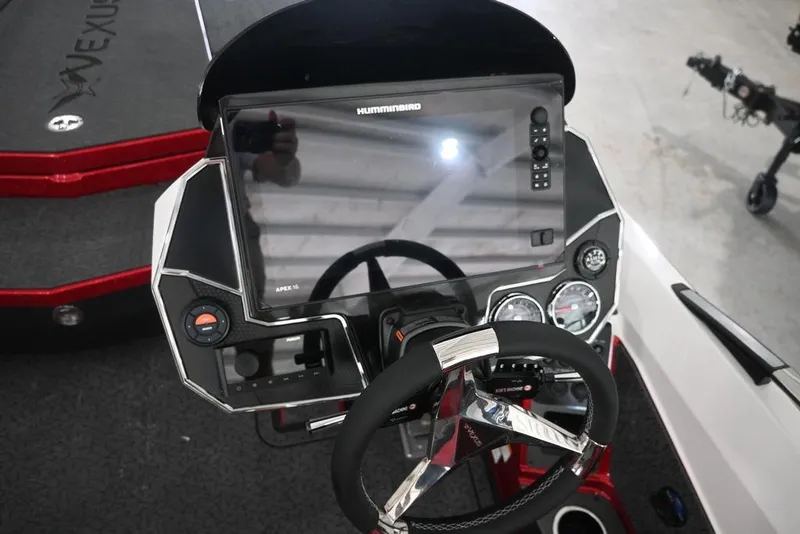 Slide: The Image of 2026 Vexus VX s21 boat dashboard with steering wheel and digital display. - 9