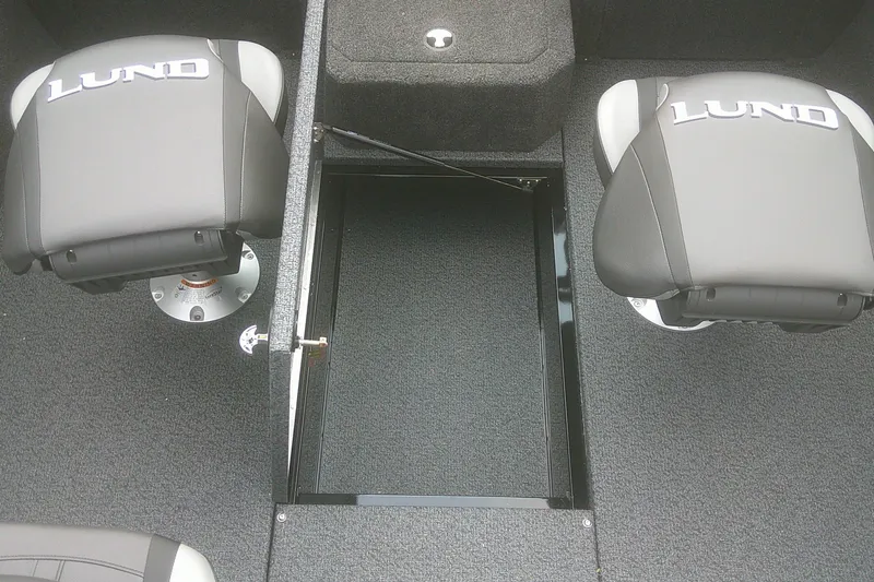 Slide: The Image of 2026 Lund 1875 Crossover XS boat interior with two seats and storage compartment. - 11