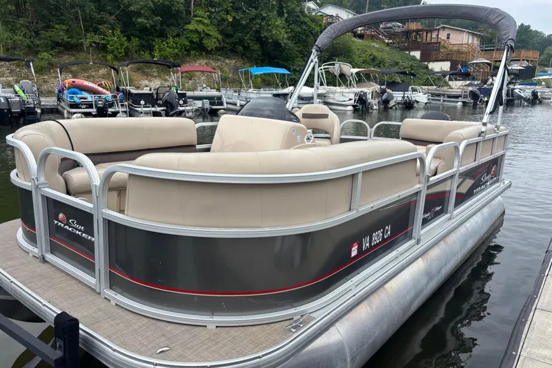 Slide: The Image of 2017 Sun Tracker Party Barge 18 DLX pontoon boat docked at marina. - 3