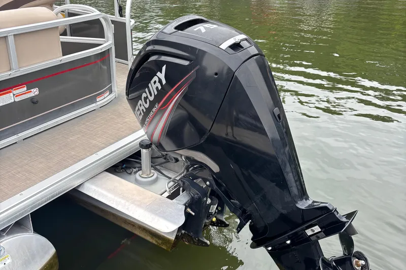 Slide: The Image of 2017 Sun Tracker Party Barge 18 DLX with Mercury outboard motor on water. - 6