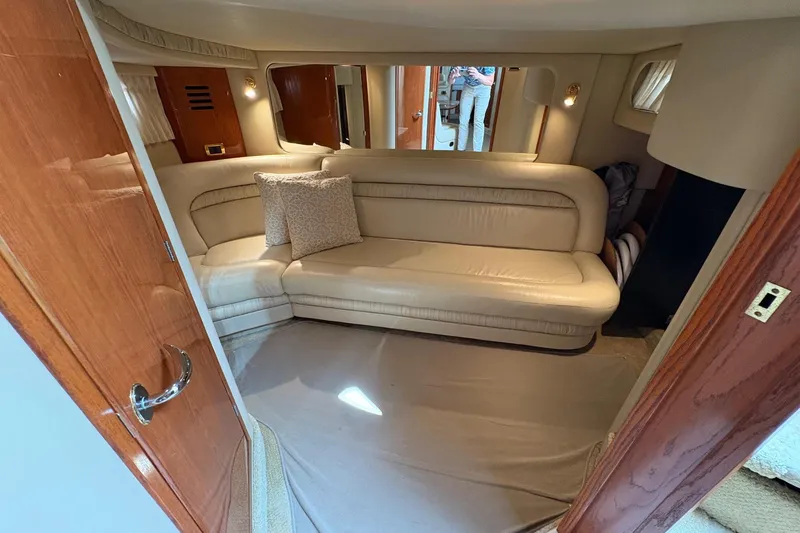 Slide: The Image of Luxurious interior of 2001 Sea Ray 460 Sundancer yacht with cream leather seating. - 45