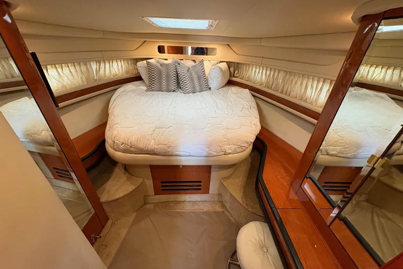 Slide: The Image of Luxurious cabin interior of 2001 Sea Ray 460 Sundancer yacht with cozy bedding. - 46