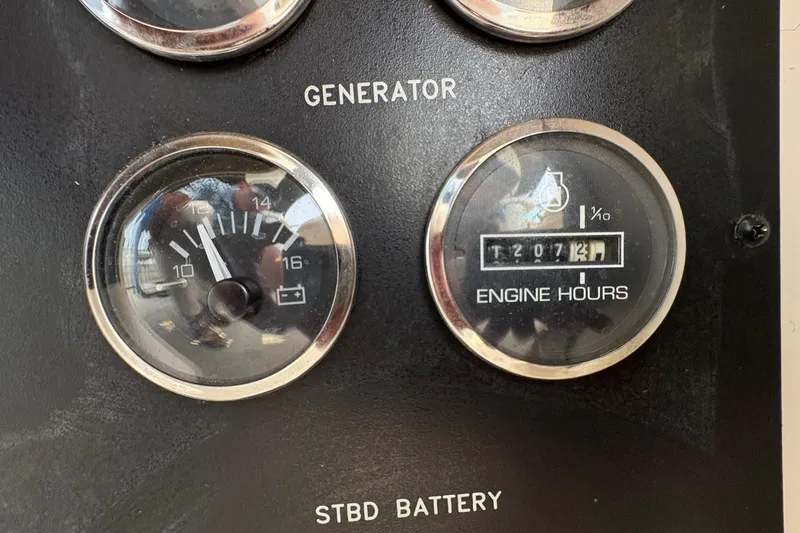 Slide: The Image of Gauge panel of 2001 Sea Ray 460 Sundancer showing generator and engine hours. - 66