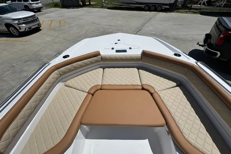 Slide: The Image of 2026 NauticStar 231 Hybrid boat with luxurious tan and cream seating. - 18