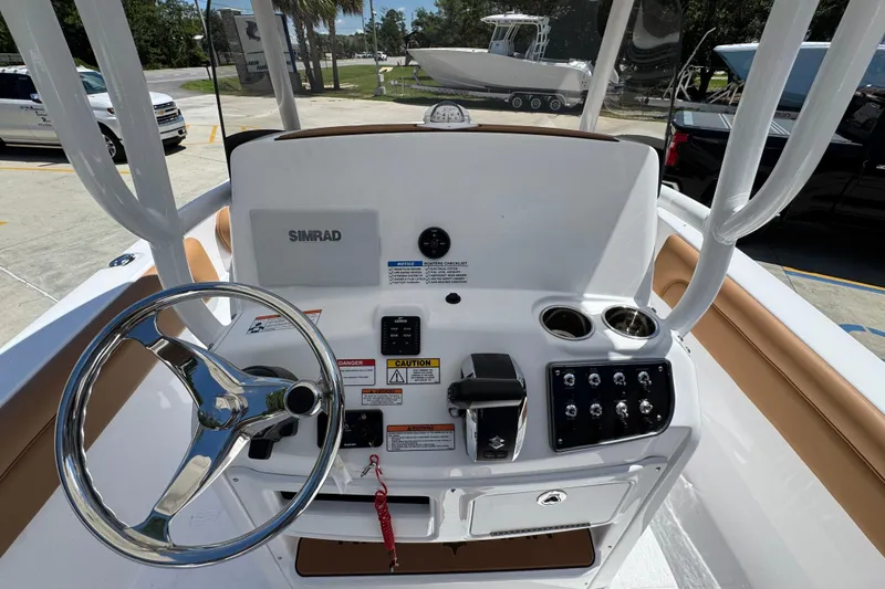 Slide: The Image of 2026 NauticStar 231 Hybrid boat console with steering wheel and controls. - 27