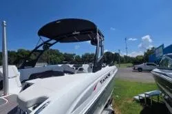 Slide: The Image of 2021 Tahoe 210 S Limited boat displayed outdoors under clear blue sky. - 10