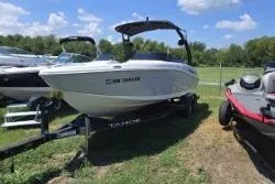 Slide: The Image of 2021 Tahoe 210 S Limited boat on trailer, parked outdoors under blue sky. - 3
