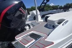 Slide: The Image of 2021 Tahoe 210 S Limited boat with sleek design and powerful engine on a sunny day. - 5