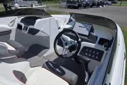 Slide: The Image of 2021 Tahoe 210 S Limited boat interior with steering wheel and dashboard controls. - 7