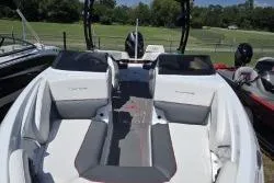 Slide: The Image of 2021 Tahoe 210 S Limited boat interior with seating and sleek design. - 8