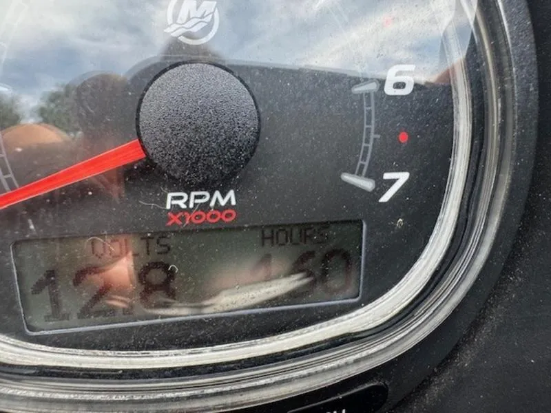 Slide: The Image of Close-up of a 2022 Bennington 25 LSB RPM gauge displaying 128 hours. - 11