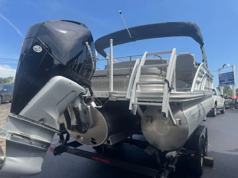 Slide: The Image of 2022 Bennington 25 LSB pontoon boat with Mercury outboard motor on trailer. - 19