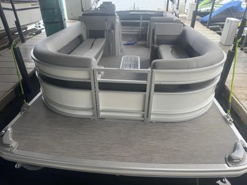 Slide: The Image of 2022 Bennington 25 LSB pontoon boat with spacious seating and modern design. - 4