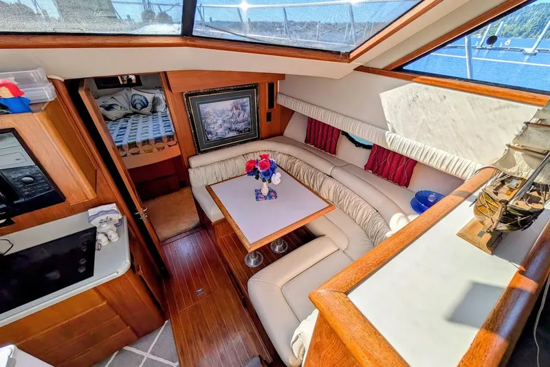 Slide: The Image of Luxurious interior of a 1990 Carver 55 yacht with elegant seating and decor. - 17