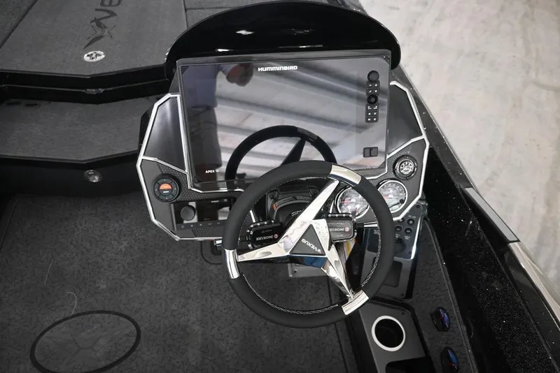 Slide: The Image of 2026 Vexus VX s21 boat dashboard with steering wheel and advanced navigation display. - 13