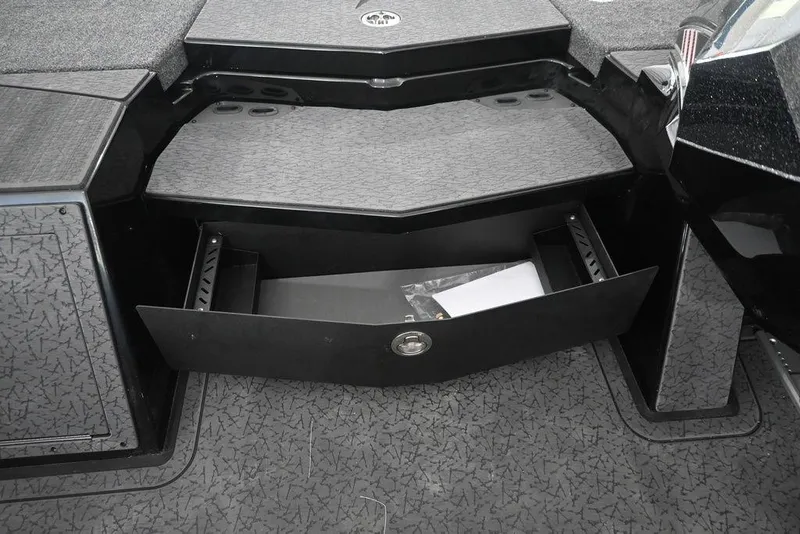 Slide: The Image of 2026 Vexus VX s21 boat storage compartment with open drawer, showcasing interior design. - 16