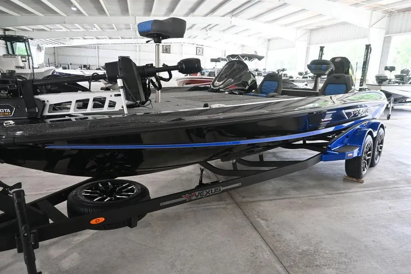Slide: The Image of 2026 Vexus VX s21 boat on trailer, showcasing sleek design and sturdy build. - 18