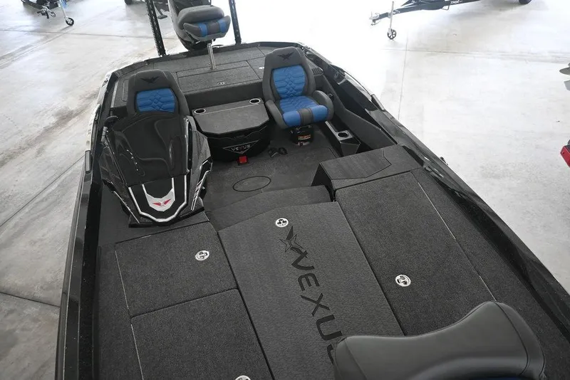 Slide: The Image of 2026 Vexus VX s21 boat emblem with sleek black and blue design. - 4