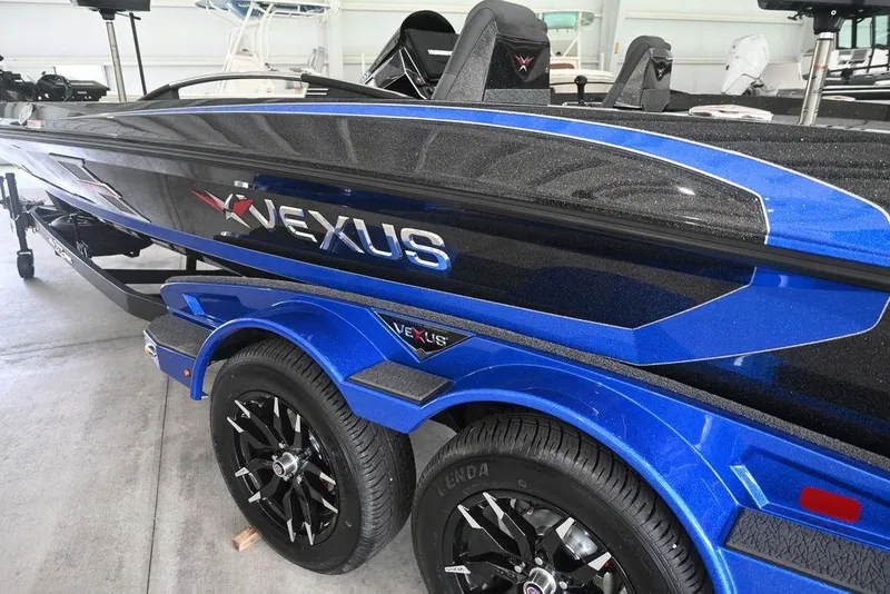 Slide: The Image of 2026 Vexus VX s21 boat interior with blue and black seating, spacious layout. - 5