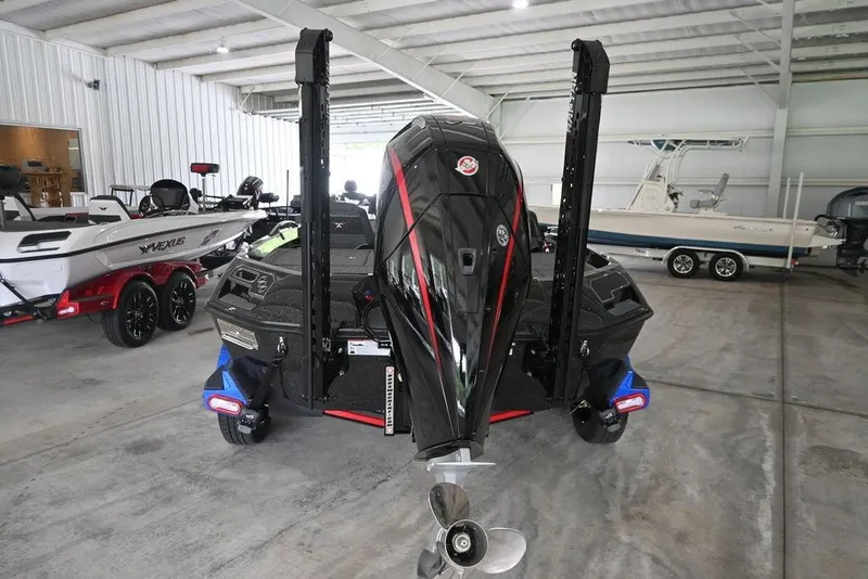 Slide: The Image of 2026 Vexus VX s21 boat in showroom, rear view with motor and trailer. - 7