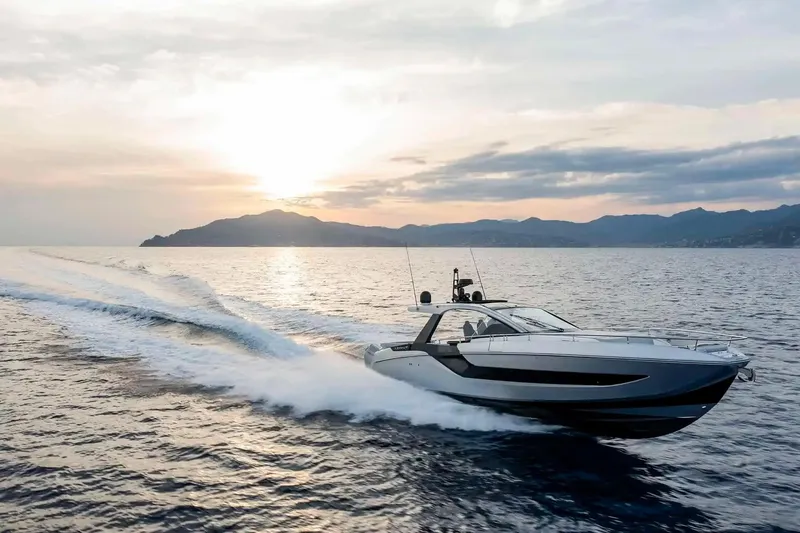 Slide: The Image of 2025 Azimut Verve 48 yacht cruising at sunset on open water. - 8
