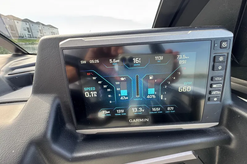 Slide: The Image of Garmin display in 2023 Axis A225 boat showing speed, RPM, and engine metrics. - 14