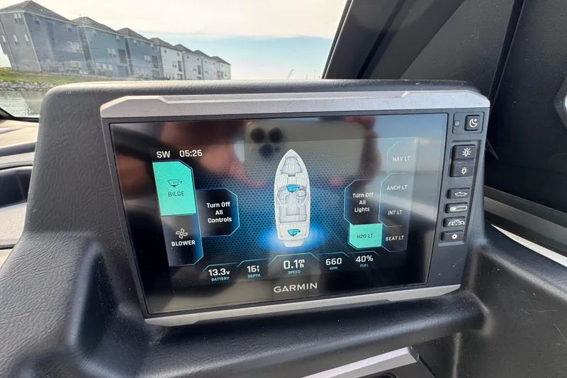 Slide: The Image of Garmin display in 2023 Axis A225 boat showing navigation and control settings. - 15