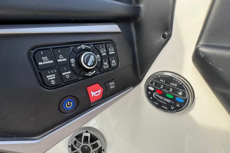 Slide: The Image of Control panel of 2023 Axis A225 boat with various function buttons and dials. - 18