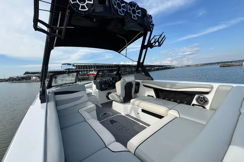 Slide: The Image of 2023 Axis A225 boat interior with spacious seating and modern design on a sunny day. - 22