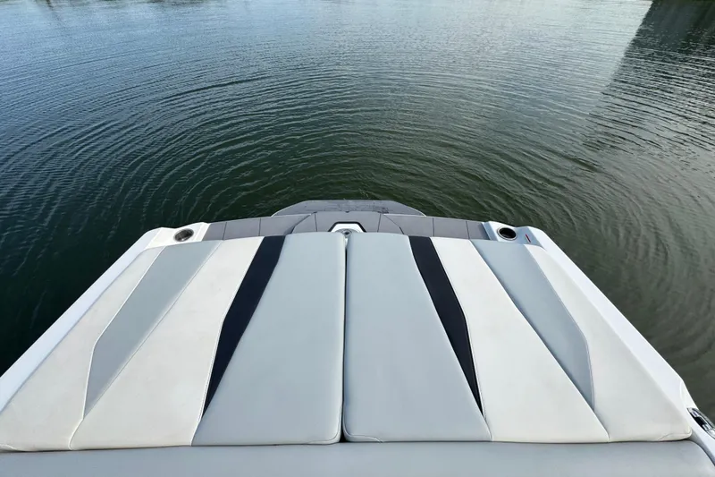 Slide: The Image of 2023 Axis A225 boat stern view on calm water. - 26