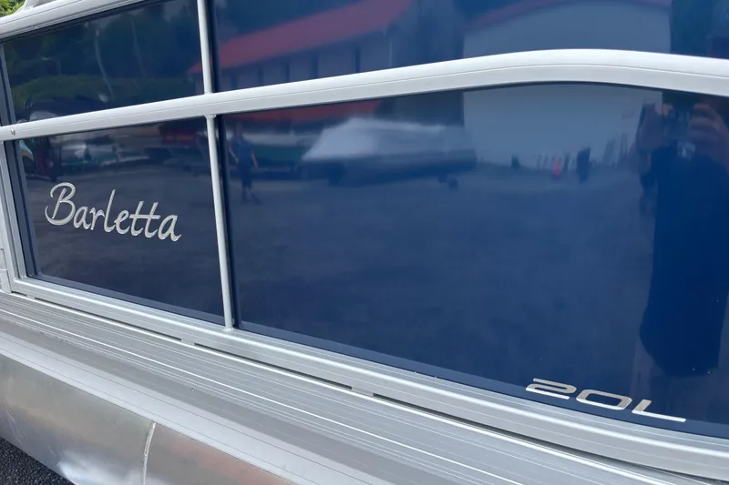 The Image of 2025 Barletta Aria 20L pontoon boat with sleek blue exterior design. - 1