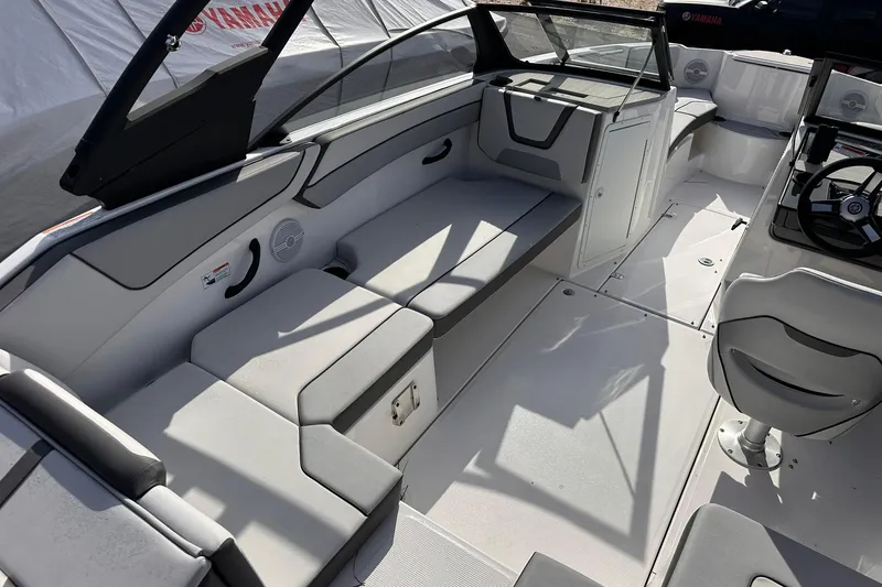 Slide: The Image of 2025 Yamaha Boats AR220 interior with sleek seating and modern design. - 11