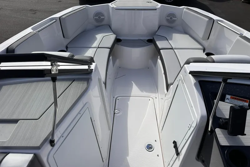 Slide: The Image of 2025 Yamaha Boats AR220 interior with spacious seating and modern design. - 15