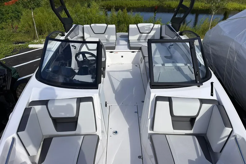 Slide: The Image of 2025 Yamaha Boats AR220 interior with sleek seating and modern design. - 17
