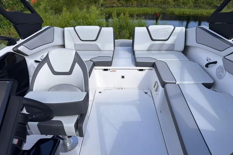 Slide: The Image of 2025 Yamaha Boats AR220 interior with modern seating and sleek design. - 18