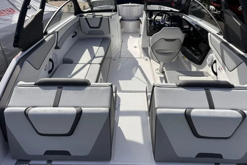 Slide: The Image of 2025 Yamaha Boats AR220 interior with modern seating and sleek design. - 9