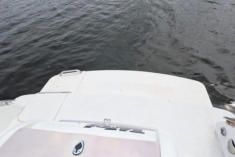 Slide: The Image of 2005 Formula 260 Bowrider boat stern on calm water. - 16