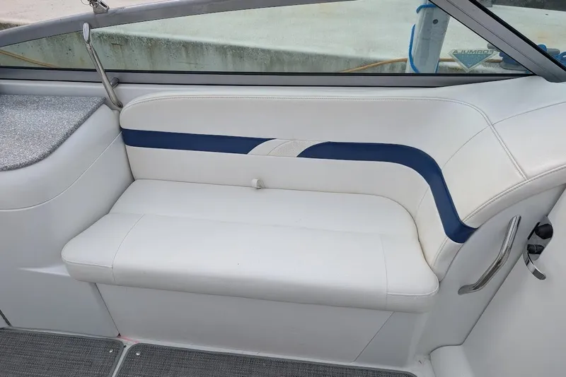Slide: The Image of 2005 Formula 260 Bowrider interior with white and blue cushioned seating. - 19