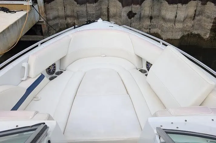 Slide: The Image of 2005 Formula 260 Bowrider boat with spacious white seating area at the bow. - 21