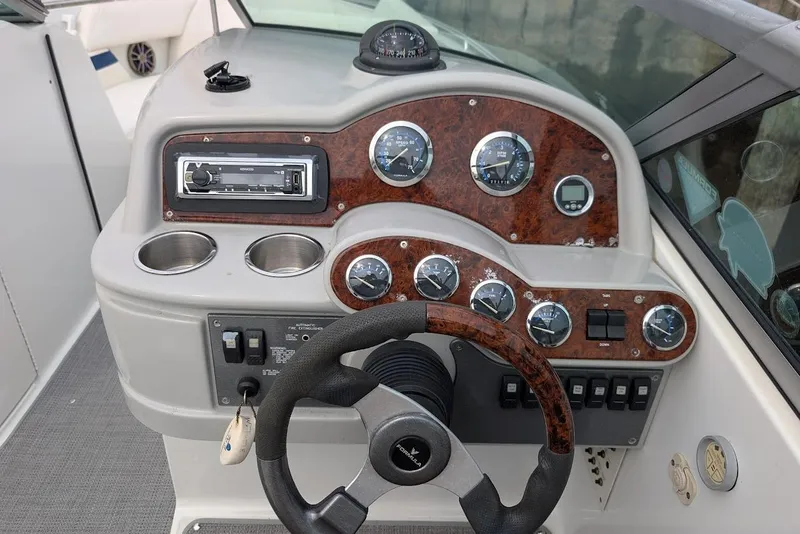 Slide: The Image of 2005 Formula 260 Bowrider dashboard with gauges, steering wheel, and controls. - 25