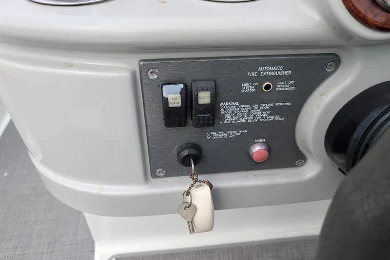 Slide: The Image of Control panel of a 2005 Formula 260 Bowrider boat with ignition key and switches. - 27