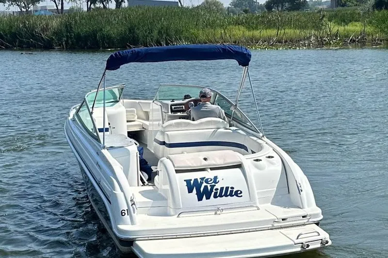 Slide: The Image of 2005 Formula 260 Bowrider boat on water, featuring "Wet Willie" name on stern. - 3