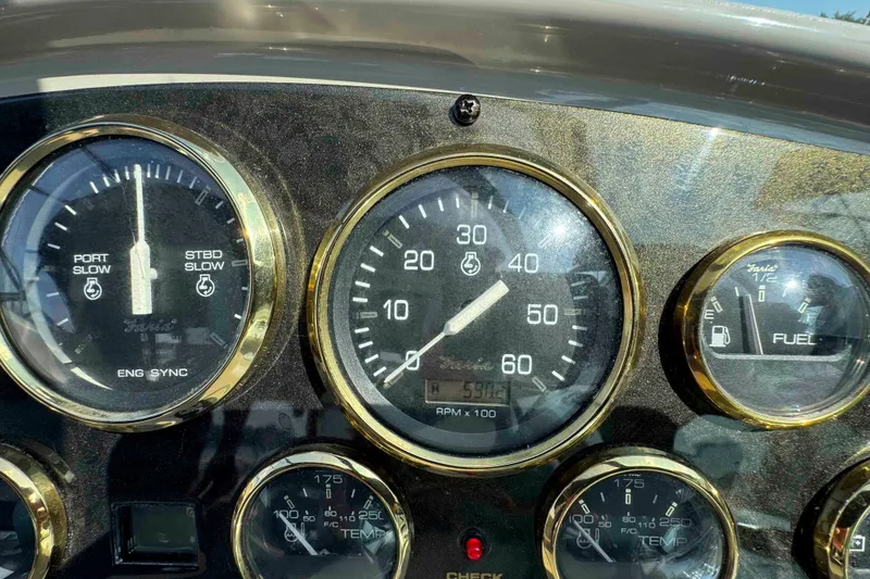 Slide: The Image of Dashboard of 2002 Cruisers Yachts 3870 Express with gauges and dials. - 15