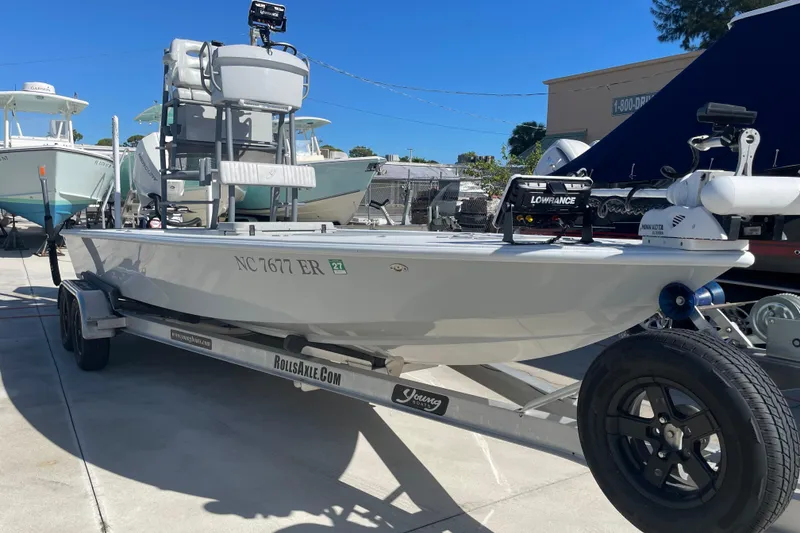 The Image of 2021 Young Boats Gulfshore 22 on trailer, equipped with Lowrance electronics, parked outdoors. - 1