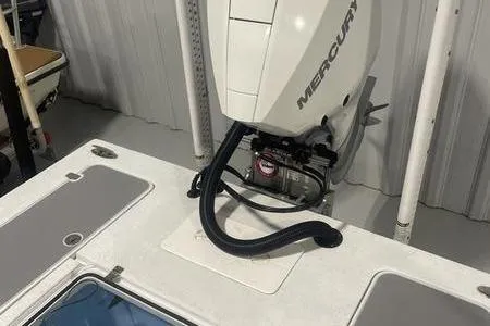 Slide: The Image of 2021 Young Boats Gulfshore 22 with comfortable gray seating and Mercury engine. - 10