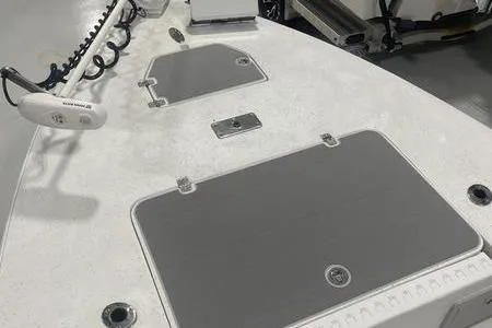 Slide: The Image of 2021 Young Boats Gulfshore 22 deck with storage compartments and livewell. - 13